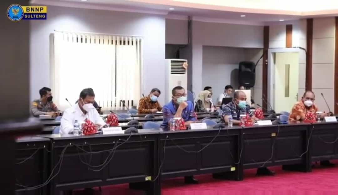 KEPALA BNNP SULTENG HADIRI RAKOR PENGENDALIAN COVID-19 JELANG AKHIR TAHUN 2021